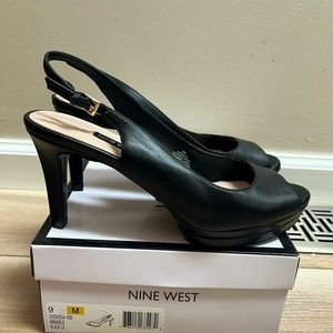 Black leather high heeled platform shoes in size 9 like new
